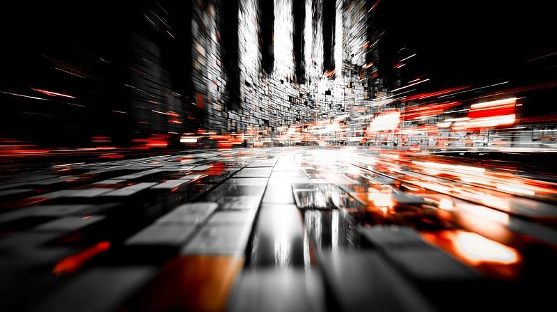 '床面に映り込む光とビル群を貫くように伸びる光線'